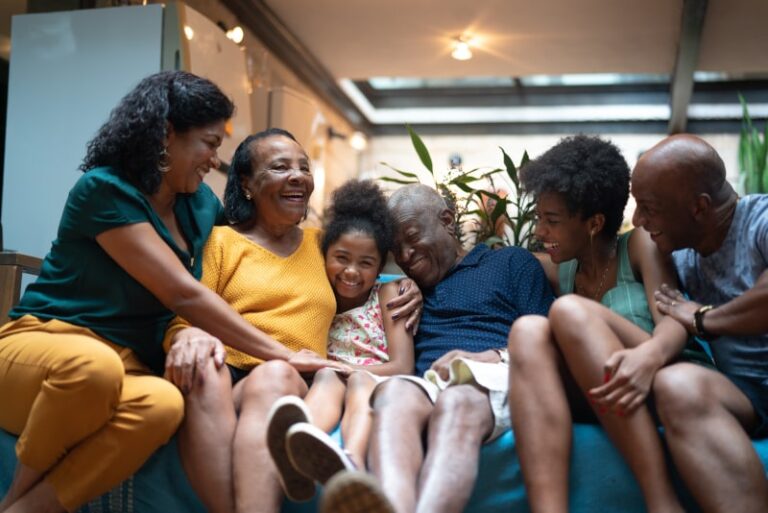 Happy Family Gathered on Couch